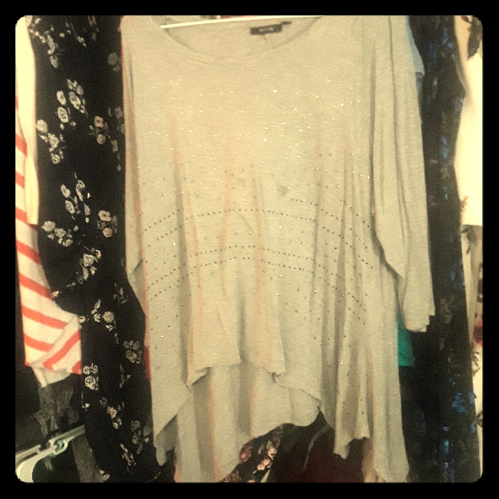 A grey blouse with rhinestones